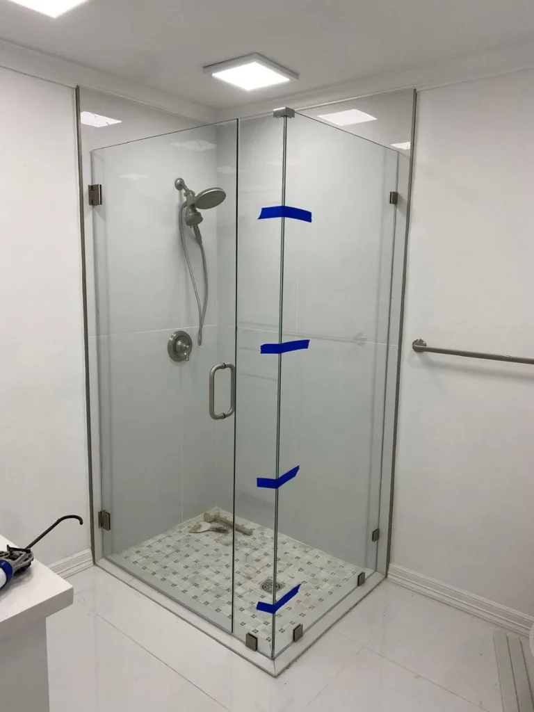 Frameless shower door and panel installation by USA GLASS