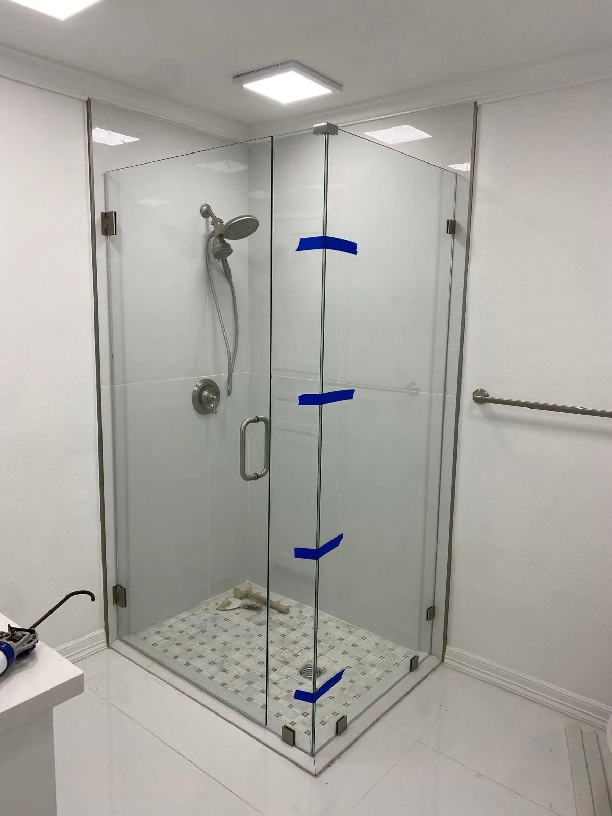 Frameless shower door and panel installation by USA GLASS